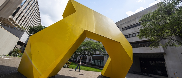 yellow metal sculpture on Pitt campus