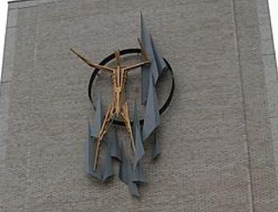 Man metal sculpture by Virgil Cantini on exterior of Pitt Public Health building