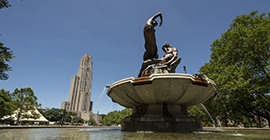 Fountain on Pitt campus depicting Greek god Pan engaged in song with a female figure